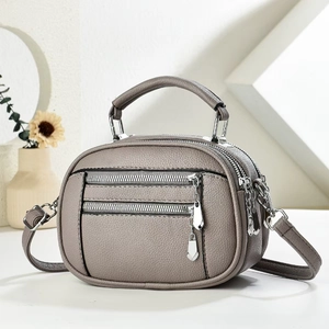 Minimalist grey multi-layer crossbody phone bag with pebble texture and silver zippers