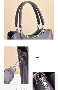 Detail view of purple PU leather handbag featuring silver hardware chain and smooth zipper