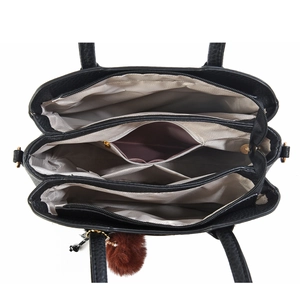 Vue de dessus montrant trois compartiments zippés spacieux de ce grand sac fourre-tout