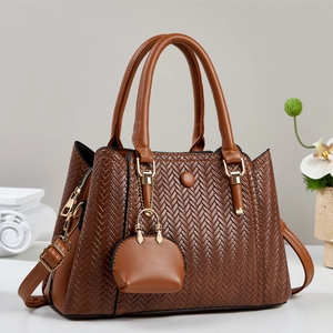 Brown woven texture tote bag with gold hardware and small detachable pouch detail