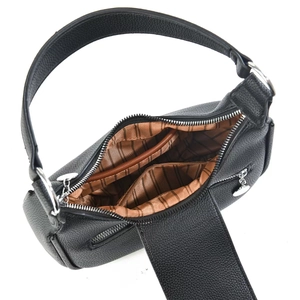 Detail view of black litchi leather bag showing striped lining and interior zipper pocket