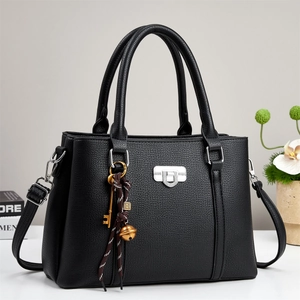 Black litchi grain satchel with silver lock and decorative charms for 2025 fashion