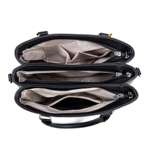 Interior detail of large black leather tote bag with three compartments and gray lining