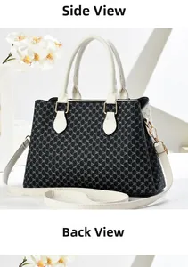Detailed side and back view of the black and white DH monogram tote bag with gold hardware