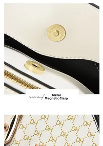Detail of cream tote bag showing gold hardware magnetic clasp and DH letter print