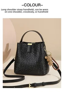 Detail of black woven leather texture on bucket bag with brown teddy bear charm