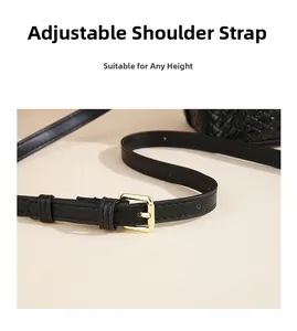 Macro detail of adjustable black woven bag strap with gold buckle and precise stitching
