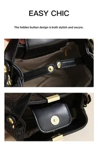 Detail of woven black bucket bag featuring golden magnetic closure and inner zipper pocket