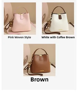 Detail showing woven texture and smooth leather buckets bags with bear charm
