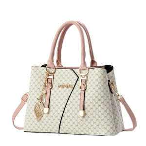 Fashionable large tote bag in beige with gold DH monogram and pink leather handles