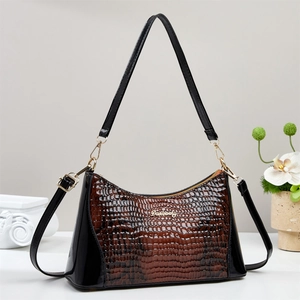 Brown and black faux crocodile embossed leather shoulder bag with gold logo and hardware