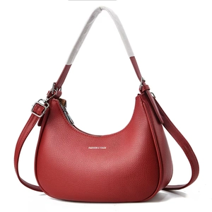 Minimalist red crescent shoulder bag in litchi grain leather with zipper closure