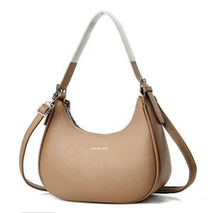 Detail of khaki crescent shoulder bag featuring litchi grain leather and fashion logo