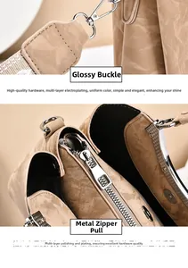 Close-up of silver hardware hooks and polished metal zipper on cracked leather handbag
