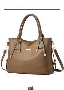 Detailed view of brown lychee-patterned tote bag with golden metal logo and dual handles