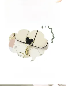 Detail of the mini crossbody phone bag with cute cartoon prints and mouse-shaped metal clasp