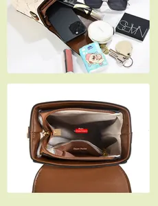 Internal view of crossbody bag showing spacious main pocket and zippered compartment