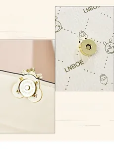 Detail of durable gold magnetic hardware and smooth edge painting on the handbag