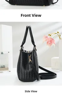 Detailed view of black woven texture handbag with golden metal hardware and studs