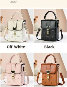 Four colors of textured crossbody mini bags with cartoon prints and heart buckle