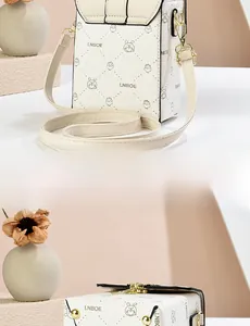 Detailed view of the back and bottom of a beige PU leather mini crossbody phone bag