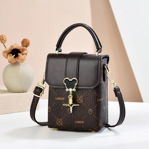 Vertical dark brown mini crossbody bag with rabbit pattern and metallic star charm