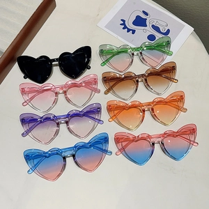 Cute heart-shaped children sunglasses in various candy colors with gradient lenses