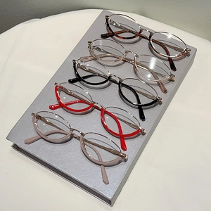 Macro shot of stylish semi-rimless glasses in tortoise shell, black and clear color frames