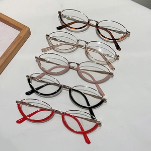 Detailed top view of retro oval half-rim glasses in multiple colors with metal temples