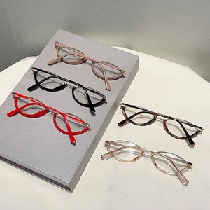 Detailed display of five colorful retro amber and metal blue light blocking glasses frames