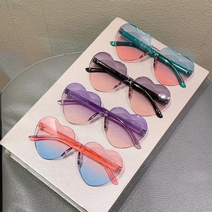 Set of four heart-shaped rimless sunglasses with trendy gradient lenses for kids