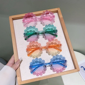 Kids' round flower-shaped sunglasses with colorful gradient lenses in four pastel shades