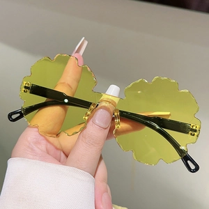 Flower-shaped rimless sunglasses for kids with yellow sunflower lenses and black temples