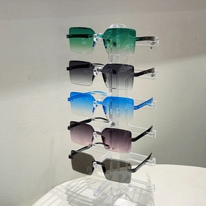 Detailed close-up of frameless geometric sunglasses in five gradient color options