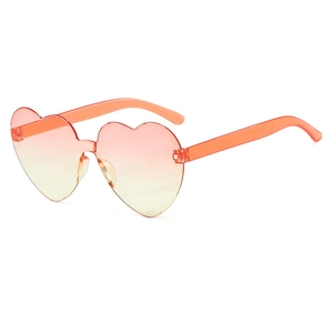 Kids heart shaped sunglasses with orange pink gradient lenses and transparent temples