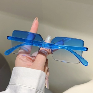 Detail of model 8512 rimless square sunglasses with blue gradient lenses and resin temples