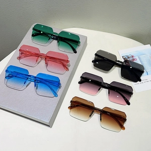 Detailed arrangement of rimless octagon sunglasses in six trendy jelly color options