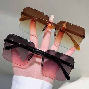 Oversized rimless wrap-around sunglasses with gradient lenses for festival party style