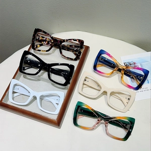 Macro display of cat eye frames in leopard, gradient, and solid color finishes