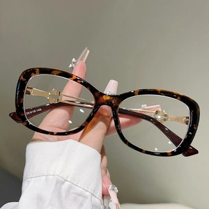 Detail of hollow metal arms and tortoiseshell cat-eye frames with size 53-19-145
