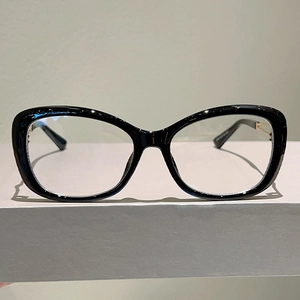 Fashionable black cat-eye glasses with hollow metal frames and anti-blue light lenses