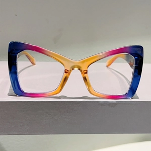Front view of cat eye glasses with blue and orange vertical gradient frame details