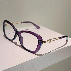 Detail of gradient purple and cyan cat-eye frames with golden twisted metal temples
