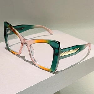 Detail of gradient cat-eye frames featuring textured golden triangle metal temple accents