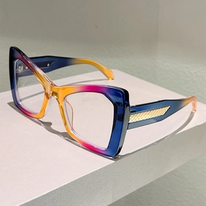 Cat eye glasses featuring three-color gradient frames and woven gold metal temple details
