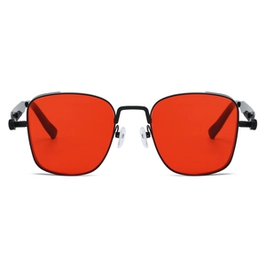 Detail of steampunk sunglasses with metallic spring hinge and vibrant red square lenses