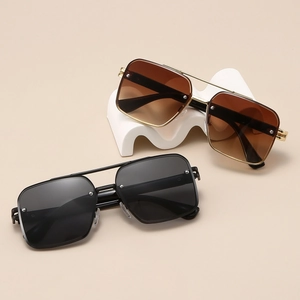 Classic pilot sunglasses with metal double bridge and rivet details in gold and black