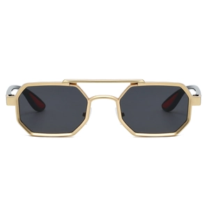 Detail of golden hexagonal metal frame sunglasses with double bridge and dark lenses