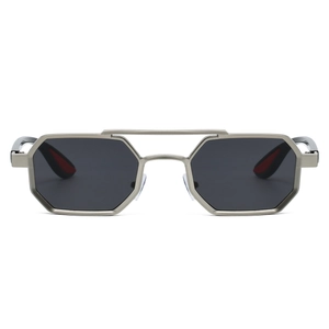 Macro detail of hexagonal metal sunglasses with double bridge and red temple tips