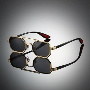 Detailed view of hexagonal metal sunglasses frame with double bridge and gold finish